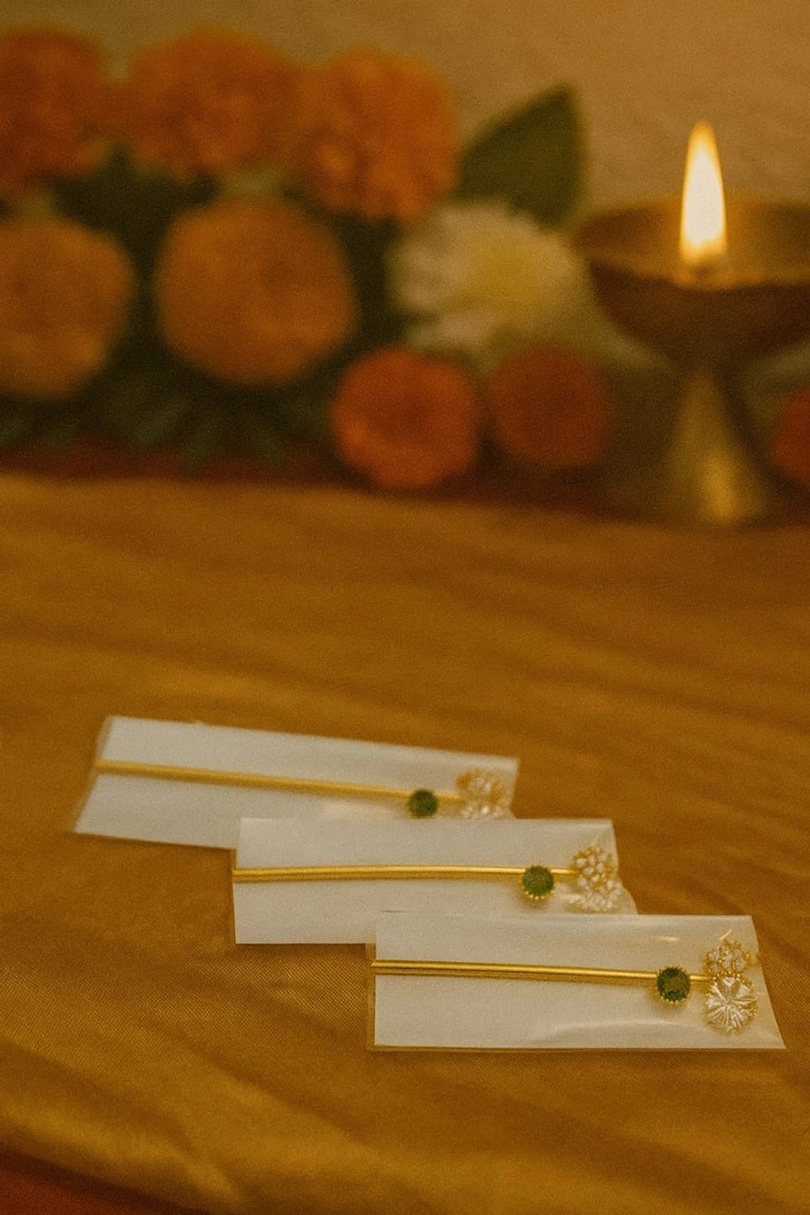 Golden Gemstone Bansuri Flute for Laddu Gopal Pack of 3 - Handcrafted golden flutes with green gemstone and white floral detailing