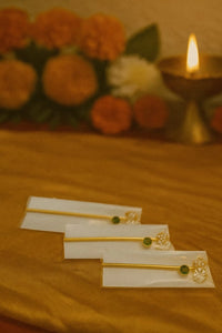 Golden Gemstone Bansuri Flute for Laddu Gopal Pack of 3 - Handcrafted golden flutes with green gemstone and white floral detailing